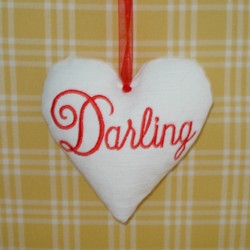 darling lettering padded heart hanging ornament made in the machine embroidery hoop lavender filled linen heart needle passion embroidery npe