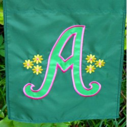 Letter A from the machine embroidery Script Applique Alphabet on a garden flag made by Debra Austin