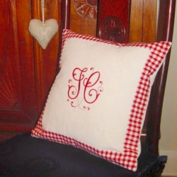 Monogrammed cushion in white cotton and red gingham border with monogram TC from the Splendor Alphabet at Needle Passion Embroidery